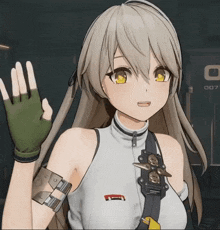 a girl in a white tank top is waving her hand