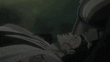 a man with a beard and glasses is laying down with his eyes closed