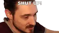 a close up of a man 's face with the words shut up above him