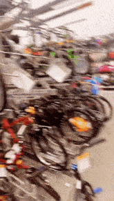 a bunch of bikes are stacked on top of each other in a store