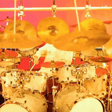 a person playing a drum set with a cymbal that says ' sabian ' on it