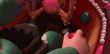 a close up of a person holding a candy cane in a candy store .