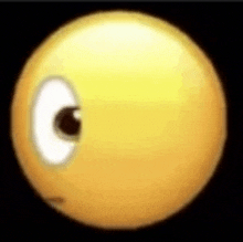 a close up of a yellow smiley face with a black background .
