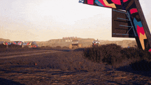 a jeep is driving down a dirt road in front of a sign that says ' cc '