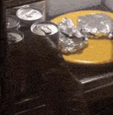 a can of diet coke sits in a fridge next to a yellow plate