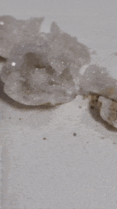 a close up of a rock with a hole in it that looks like a diamond