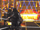 a woman in a wrestling ring with a w logo on the ropes