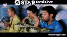 a group of men are sitting on a plane eating food with a star tamil chat logo in the background