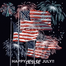 a bunch of american flags are flying in the wind with fireworks behind them .