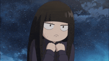 a girl with long black hair is looking at the camera