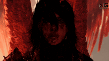a painting of a woman with blood on her face and the letter g on the bottom right
