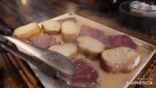 a plate of food with the words made in animatica on the bottom right