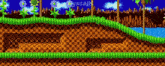 a sonic the hedgehog video game background with a checkered pattern and a hole in the ground .