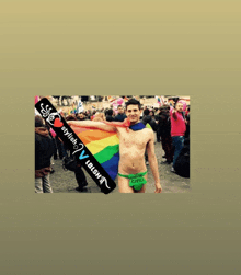 a shirtless man holding a rainbow flag and a sign that says " stylish "