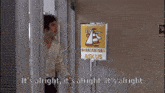 a man says it 's alright in front of a sign that says sk us