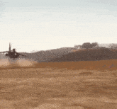a fighter jet is taking off from a runway in the desert