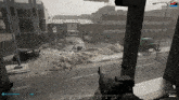 a screenshot of a video game shows a person holding a gun in front of a building