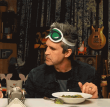 a man wearing ski goggles says i was right in front of a bowl of food