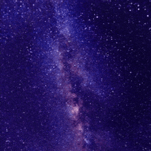 a milky way galaxy in a purple sky