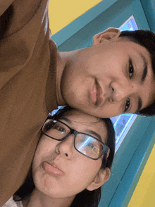 a man and a woman are posing for a picture together