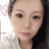 a close up of a woman 's face with a drawing of hearts behind her