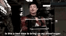 a man in a superhero costume is saying `` is this a bad time to bring up my blood sugar `` .
