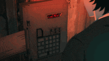 a person is pressing a button on a box that says reg