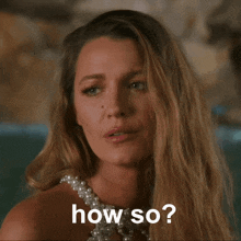 a woman in a pearl dress says " how so "