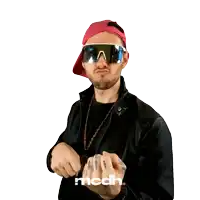 a man wearing sunglasses and a necklace with a dollar sign giving the middle finger
