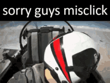a man wearing a helmet is sitting in a cockpit of an airplane .