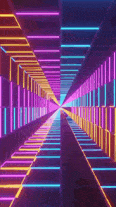 a tunnel with a lot of neon lights going through it .