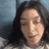 a close up of a woman with her eyes closed