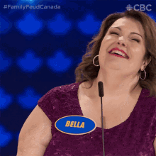 a woman wearing a name tag that says bella on it