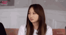 a woman sitting on a couch with the words honeycam lunch time on the bottom right