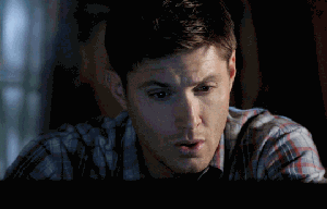 Dean from Supernatural looks away and closes his computer