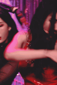 a woman in a red top is dancing with her hand on her hair