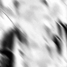 a black and white photo of a blurred background