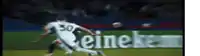 a blurry picture of a soccer game with the word heineken in the background
