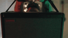 a close up of a person 's hands holding a black device