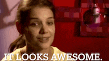 a woman says it looks awesome in front of a red background