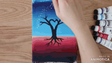a painting of a tree with a heart shaped trunk is made by animatica