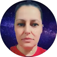 a woman 's face is shown in a circle with a starry background
