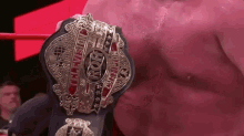 a man is wearing a wrestling belt that says intercontinental champion on it .