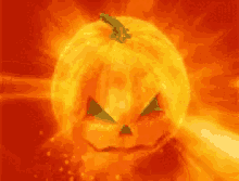 a halloween pumpkin with a scary face is surrounded by flames and smoke .