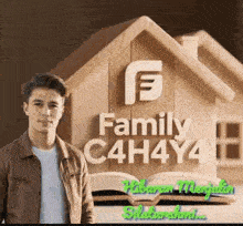 a man is standing in front of a wooden house with the words `` family c4h4y4 '' on it .