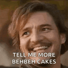 a man is smiling and saying `` tell me more behbeh cakes '' while looking up .