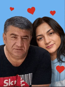 a man and a woman posing for a picture with hearts around them