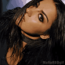a close up of a woman 's face with mafia rbdgif on the bottom