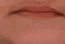 a close up of a person 's mouth with their mouth open and their teeth visible .