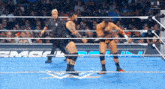 two wrestlers in a wrestling ring with the word smackdown on the bottom